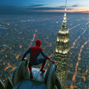 In the picture Spider-Man crouches on top of a skyscraper overlooking New York city while the sun sets in the background.
