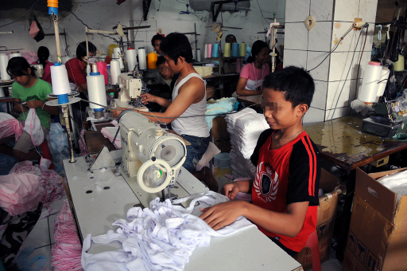 Child workers in a small clothing factory in Jakarta, Indonesia.